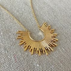 Just a beautiful sunrise to brighten up your day to wear around your neck. This necklace has some strong boho vibes with a touch of that popular sunburst seen in Mid-century décor. Wear it solo or layer it for a maximalist effect. Nickel free 14k gold plated brass Pendant [1.5"] Adjustable [+2" to chosen length] Proudly handmade in the USA Arrives gift boxed Chain Layering, Boho Mid Century, Sun Necklace, Box Handmade, Oval Earring, Chain Extenders, Beautiful Sunrise, Rising Sun, Layering Necklace