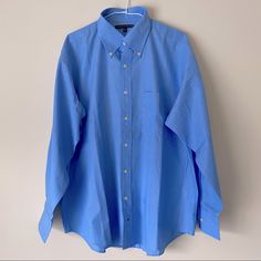 Brand: Tommy Hilfiger Size: L Neck: 16 1/2 Inches Pit To Pit: 26 Inches Shoulder + Sleeve: 30 Inches Length: 32 - 33 Inches Color: Blue Style: Classic Fit Solid Color Dress Shirt Features: Collar Neck, Long Sleeves, Cuffed Sleeves, Front Button Closures, Front Pocket, Comfort, Easy Care. Fit: Classic Condition: New Without Tags Fabric Content: 55% Cotton 45% Polyester Care: Machine Wash Warm / Use Only Non-Chlorine Bleach When Needed / Tumble Dry Low / Remove From Dryer Promptly / Put On Hanger Classic Blue Long Sleeve Dress Shirt, Tommy Hilfiger Long Sleeve Work Shirt, Tommy Hilfiger Long Sleeve Shirt For Work, Blue Relaxed Fit Button-up Dress Shirt, Blue Relaxed Fit Dress Shirt For Spring, Tommy Hilfiger Blue Collared Shirt, Blue Collared Tommy Hilfiger Shirt, Blue Cotton Dress Shirt For Spring, Fitted Blue Tommy Hilfiger Shirt