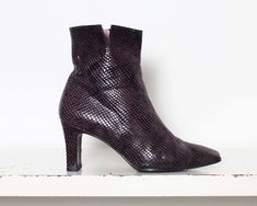 00s black cherry| purple genuine leather boots> snakeskin shiny textured print> pastel pink leather interiors> square toe> slits> inner ankle zip closure label> [cant read label] size> eu 37 1/2 insole length> 26cm sole width> 8cm heel height> 8cm height> 23cm condition> excellent vintage condition Fitted Purple Pointed Toe Boots, Luxury Fitted Purple Boots, Fitted Ankle-high Purple Boots, Silver Leather Ankle-high Heeled Boots, Purple Leather Ankle-high Boots, Womens Booties, Genuine Leather Boots, Booties Ankle Boots, Snakeskin Print