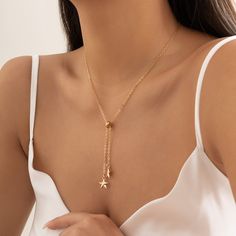 Goldtone necklace featuring a tasseling pendant finished with stars. 19.69'' L with 2.75'' extender Lobster claw clasp Goldtone copper Metal Star, Y Necklace, Metal Stars, Enamel Bracelet, Positive Messages, Letter Necklace, Gold Plated Necklace, Chain Choker, Star Charms