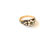 Darling little Georgian ring with that ticks all your 'dreamy antique' boxes: A luminous pearl halo? Check. One tiny-but-*perfect* rose cut center diamond? Check. Intricate filigree work in striking, sapphire colored enamel? Checkity-check. She's even got a tiny, hidden compartment behind the band to store a sentimental reminder of a cherished loved one or admirer. We know it ain't a real antique ring unless it's got a *secret* compartment and here again, this beauty delivers! Slight losses to t Georgian Ring, My Moon And Stars, Emerald Diamond Ring, Sapphire Color, Pearl Diamond, Diamond Cluster Ring, Emerald Diamond, Diamond Cluster, Cluster Ring