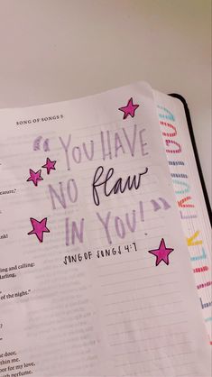 an open bible with pink stars on it and the words you have no fear in you