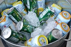 an ice bucket full of cans of beer