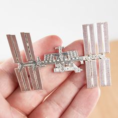 The most accurate International Space Station Enamel Pin on Etsy! As true to the original ISS as we could make it. This hard enamel pin makes the perfect gift for your resident astronaut, scientist, astronomer, rocket engineer, or space lover.  100 pins made.   1st Edition.  Year: 2021 Silver plated brass pin. 3 inches Comes individually packaged with two silver butterfly clasps. Space Scientist, Nasa Gifts, Lapel Brooch, Nasa Space, Brass Pin, International Space Station, Space Station, Hard Enamel Pin, Button Pins