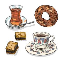 a cup of coffee and some pastries on a plate