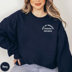 Introducing our "Out of Breath Hiking Society" sweatshirt--a perfect blend of comfort and humor for the avid hiker in your life! Crafted with cozy fleece and featuring a playful design, this sweatshirt proudly declares membership in the exclusive club of those who conquer trails at their own pace. The witty slogan, "Don't worry, I'll be there in a minute," adds a touch of lightheartedness to the hiking experience, making it an ideal gift for anyone who loves the great outdoors and embraces the j Sporty Cotton Sweatshirt For Hiking, Sporty Crew Neck Sweatshirt For Hiking, Crew Neck Cotton Hoodie For Hiking, Climbing Shirt, Nature Hoodie, Out Of Breath, Exclusive Club, Camping Nature, Lovers Gift