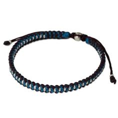 This unique braided bracelet presented by Napapat is inspired by the Hill Tribe artisans of Thailand. She hand braids turquoise blue and dark red polyester cords to craft this bracelet with silver beaded accents. It features a sliding knot for easy adjustment. Blue Woven Jewelry For Friendship, Blue Braided Friendship Bracelets, Adjustable Blue Woven Braided Bracelet, Adjustable Blue Braided Bracelet, Handmade Blue Braided Nylon Cord Bracelets, Handmade Blue Braided Bracelets In Nylon Cord, Handmade Blue Nylon Cord Braided Bracelets, Adjustable Blue Woven Bracelets, Adjustable Blue Woven Bracelet