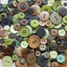 a pile of buttons sitting on top of a table