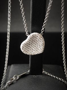 "A special gift for your sweetheart  This floating heart pendant necklace exudes grace and elegance. Crafted in a luxurious 18K white gold, this is a piece to wear and treasure every day. ITEM INFORMATION : 18k white gold The necklace is 42cm (16.5 inches).  Pendant  + Necklace Weight - 9 g Stone - Natural white diamond (118 stones) Weight - 1.18 ct  Cut - Round brilliant cut diamond Setting - micro pave fishtail Clarity - VS-VVS Color - D/E/F COLLECTION 18k solid white gold, Slide heart pendant Heart Shaped Diamond Necklace, Diamond Necklace Pendant, Diamond Heart Necklace, Pave Necklace, Heart Necklace Diamond, Pendant Diamond, Puffed Heart, Heart Diamond, Heart Pendant Diamond