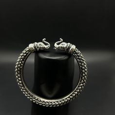 Name of product: Silver Elephant bracelet. WEIGHT: 55 grams. Inner Width: 6.5 centimeters (Adjustable) FREE EXPRESS SHIPPING -----Feedback::- A satisfied customer is our top priority and your feedback forms the backbone of our success. Don't forget to give positive feedback along with good ratings. Thank You Silver Bracelets For Men, Mens Silver Bangle, Elephant Bracelet, Silver Elephants, Bridal Bangles, Silver Bangles, Silver Man, Bangle Bracelets, Silver Bracelet