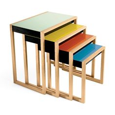 three wooden tables with different colored tops