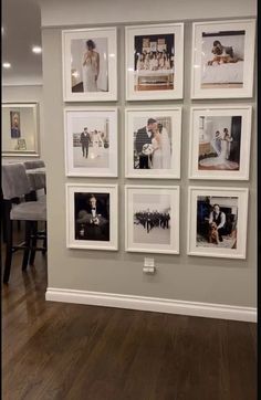 a living room with pictures hanging on the wall