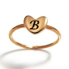 "This rose gold plated initial heart ring is ideal for engraving, it is has a smooth heart shaped surface which is perfect for a single letter. Whether it is your own, or your loved one initial, the stackable initial heart ring is a very unique way to show personalized touch. The rose gold heart ring is elegant and trendy and is great on its own or in a stacked with additional rings. It will be a perfect gift for a birthday, anniversary or any occasion. Customization: * You can order this ring i Adjustable Gold Heart-shaped Initial Ring, Adjustable Gold Heart Initial Ring, Rose Gold Heart Ring For Gift, Personalized Rose Gold Heart Promise Ring, Personalized Rose Gold Promise Heart Ring, Personalized Rose Gold Heart Ring For Valentine's Day, Valentine's Day Heart Ring With Initials For Promise, Heart Shaped Initial Ring For Wedding, Heart-shaped Initial Ring For Wedding