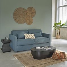 a living room with a blue couch and coffee table