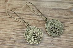 "Brass Earrings Dangle Earrings Drop Earrings Tree Earrings Leaf Earrings Nature lover gift For Her Gift For women Finish : Antiqued Brass Tree round Size : 2\"3/4 inches including the antiqued Brass kidney ear wire Ear wires : Antiqued Brass kidney ear wire Brass earrings section : https://www.etsy.com/shop/NtikArtJewelry?ref=seller-platform-mcnav&section_id=16059931 Thanks for looking" Bohemian Leaf-shaped Metal Earrings, Nature-inspired Metal Drop Earrings, Boho Jewelry Earrings, Earrings Nature, Rustic Earrings, Botanical Earrings, Tree Earrings, Fall Earrings, Earring Tree