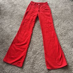 These are in great condition! Super fun bright red corduroy flared jeans. Perfect condition for hemming if they are too long, as the edges are serged and won't have to be undone.  26" waist 10.5" rise 35" inseam B06 Red Cotton Flare Jeans, Red Flare Cotton Jeans, Red Flared Cotton Jeans, Red High Waist Flare Jeans For Spring, Red Wide Leg Flare Jeans For Fall, Red High-waist Corduroy Bottoms, Red Vintage Bottoms For Fall, Red High Waist Fitted Flare Jeans, Fitted Red Flare Jeans For Spring