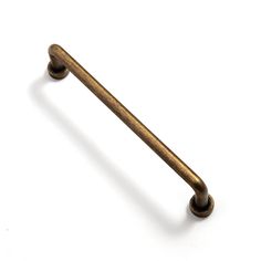 an antique brass cabinet pull handle on a white background with clipping for text or image