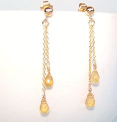 Citrine Earrings. Wire Wrapped. Gold Chain Earrings. Yellow dangles. Citrine earrings. November Birthstone.  Sun kissed, delicate, yellow Citrine gemstonewire wrapped in 14 k gold fill posts earrings.  These Citrine briolettes are untreated, faceted teardrops, approximately 8 x 6 mm each. All metal parts (chain, earwire, jump rings, wire) are 14k gold filled, tarnish resistent. The earrings are 2 inches long. Available in sterling silver or with different stones or Swarovski crystals.Matching ne Citrine Dangle Earrings For Pierced Ears, Citrine Dangle Earrings, Rings Wire, Gold Chain Earrings, Earrings Wire, Citrine Earrings, Yellow Citrine, November Birthstone, Matching Necklaces