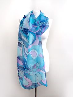 Hand painted scarf with Pegasus made of natural silk, in purple - blue - turquoise color set. This fantasy designer scarf is made to order. The Pegasus is a magical creature, a winged horse symbolizing wisdom and fame and more recently poets' inspiration (so imagine what a lovely gift the scarf would made for your poet friend). The Pegasus scarf depicts the winged horse flying with two peacocks on a starry, cloudy night sky. It is composed with tones of cool blue and turquoise, soft pastel mint Elegant Hand Painted Blue Silk Scarf, Blue Shawl Scarf For Gift, Elegant Hand Painted Blue Scarves, Elegant Blue Hand Painted Scarves, Artistic Blue Silk Scarf, Blue Hand Painted Silk Scarf, Artistic Blue Silk Scarves, Bohemian Blue Silk Scarf Gift, Bohemian Blue Silk Scarf As Gift