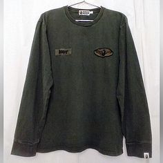 Excellent Used Condition Vintage Bape Bathing Ape Dark Green Long Sleeve Tee. Size Large. Approx Measurements: Chest 21", Sleeve 23.5", Length 26.5". Small Bit Of Fading In Some Areas But In Really Great Condition. No Rips, Tears, Or Holes. Please See All Pics As They Are Part Of The Description. All Offers Considered. Long Sleeve Bape Shirt, A Bathing Ape Bape Sta Low, Bape Shirt, Green And Brown, Dark Green, Product Description, Long Sleeve Tees, Tee Shirts, Mens Shirts