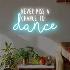 there is a neon sign that says never miss a chance to dance on the wall