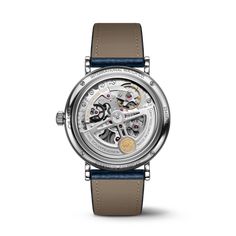 The Portofino Perpetual Calendar features the legendary perpetual calendar developed by Kurt Klaus during the 1980s. White Gold Automatic Watch For Gift, White Gold Automatic Watch As Gift, Anniversary White Gold Watches With Skeleton Dial, Timeless White Gold Watch With Skeleton Dial, Luxury White Gold Watches With Skeleton Dial, Elegant Silver Watch With Skeleton Dial, Elegant Automatic White Gold Watch Accessories, Automatic White Gold Watch Accessories For Anniversary, Formal Silver Watch With Skeleton Dial