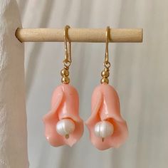 COLOR: Gold, Peach The sweetest little earrings to give any look that little, extra something. ﻿DETAILS + CARE: 14K Gold Filled Lily Flower Earrings, Clay Calla Lily, Calla Lily Earrings, Polymer Clay Calla Lily, Lucite Flower Earrings, Little Earrings, Clay Earring, Instagram Tags, Piercing Ideas