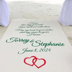 a wedding ceremony aisle with two hearts on it and the names of the couple's guests