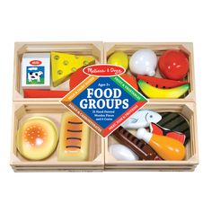 a wooden box with food groups in it