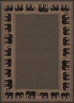 an area rug with elephants on it in black and tan colors, including the border