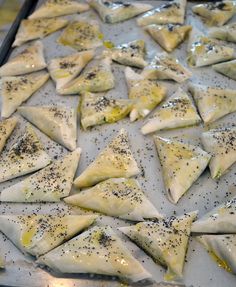 some food is laying out on a baking sheet and ready to be cooked in the oven