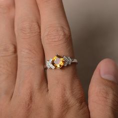 This is a gorgeous handmade creation. Its beauty is its simplicity & Elegance. The 7*7 mm cushion shape faceted natural citrine is crafted in solid sterling silver and with rhodium plated. All item is sent in a beautiful gift box If you have any idea of design your ring,pls contact me directly. You can realize more lovely stuff clicking the link https://www.etsy.com/shop/knightjewelry?refshopsection_shophome_leftnav Please leave the correct address and you phone number for delivering success Elegant Citrine Crystal Ring With Birthstone, Yellow Citrine Cushion Cut Ring, Elegant Citrine Birthstone Crystal Ring, Fine Jewelry Citrine Topaz Ring With Accent Stones, Fine Jewelry White Gold Citrine Topaz Ring, White Gold Citrine Birthstone Ring With Gemstone, Citrine Cushion Cut Jewelry For Anniversary, White Gold Citrine Rings With Accent Stones, Citrine Topaz Promise Ring