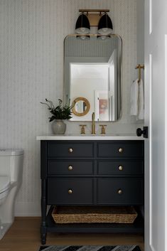 a bathroom with a sink, mirror and rug on the floor in front of it