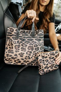 the only thing better than a brand-new purse? a purse that comes with a matching clutch! our livy shoulder bag and clutch is what your animal print accessory dreams are made of. this structured, stylish bag features: three interior pockets a top zipper to keep everything inside secure a detachable crossbody strap a wristlet clutch to wear on its own or toss in your bag to keep things organized the livy is made from soft vegan leather that is both durable and easy to keep clean. and because we kn Leopard Print Rectangular Bag For Everyday Use, Leopard Print Large Capacity Shoulder Bag For Everyday Use, Leopard Print Satchel Bag For On-the-go, Leopard Print Pouch Shoulder Bag For Daily Use, Leopard Print Everyday Shoulder Bag, Daily Use Leopard Print Bags With Removable Pouch, Leopard Print Satchel Shoulder Bag For On-the-go, Leopard Print Shoulder Bag With Removable Pouch For Shopping, Leopard Print Satchel For Everyday Use