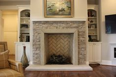 a living room with a fire place and bookcases