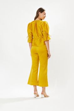 Elevate your style with the primrose yellow silk blouse, featuring intricate rosa hand embroidery and a self-tie detail at the waist. Paired harmoniously with a cotton inner, and complemented by primrose yellow silk pants lined with cotton, this ensemble exudes sophistication and comfort for a chic and refined look. Yellow Silk Sets For Spring, Yellow Silk Set For Summer, Primrose Yellow, Personal Shopping Service, Yellow Silk, Yellow Blouse, Silk Pants, Yellow Fabric, Cotton Voile