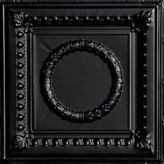 a black square frame with a circular design