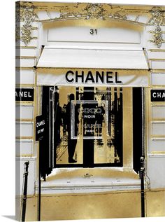 a chanel store front with gold and black accents