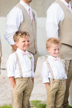 three young boys wearing suspenders and bow ties