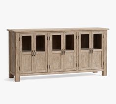 the sideboard is made out of wood and has glass doors