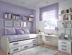 a bedroom with purple and white decor, bookshelves on the wall and desk