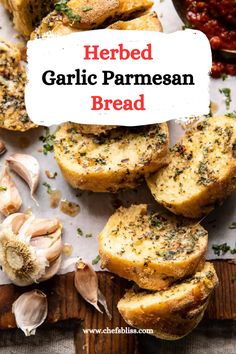 herb garlic parmesan bread on a cutting board with garlic and herbs in the background