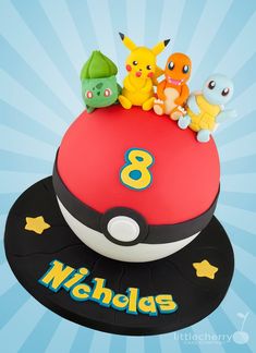 a pokemon birthday cake with the number eight surrounded by pikachu and other characters