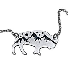 One of our favorite scenes of wildlife and nature, Mountains and bison, a wonderful combination to wear at any occasion. For this necklace, we have taken our very popular high alpine design and put it on the cutout of a bison. This necklace is available on a 18" simple cable chain or a 30" cord. Both are adjustable so can be worn shorter. You can request longer. Beads may vary on cord necklaces. This style is offered in two finishes: Matte Silver and Antique Brass. Click here to learn more about Cord Necklaces, Alpine Design, Mountain Jewelry, Nature Mountains, Cuff Rings, Leather Cuffs Bracelet, Leather Cuffs, Cord Necklace, Ring Bracelet