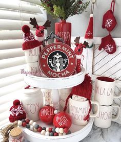 there is a christmas display with cups and mugs