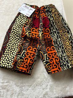 Unleash your summer style with our Moji Ankara shorts! Perfect for the beach, hikes, and beyond, they offer unbeatable comfort and undeniable style. Experience the ultimate blend of fashion and function. Get the best buy for your summer wardrobe now. Size and Fits: Please refer to the size guide in the gallery for best fit. Shorts has pockets on both sides. Elastic waist for comfort. Color may vary due to lighting of images. The images of models are closest to the true color of the fabric. Care Cotton Athletic Shorts For Beach, Cotton Athletic Shorts For The Beach, Beach Bermuda Shorts With Elastic Waistband, Cotton Athletic Shorts For Beach With Short Legs, Cotton Bermuda Beach Shorts, Cotton Bermuda Shorts For The Beach, Multicolor Shorts With Pockets For Vacation, Multicolor Vacation Shorts With Elastic Waistband, Traditional Beach Bottoms With Pockets