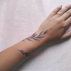 a woman's arm with a tattoo on it