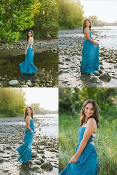 a woman in a blue dress standing on rocks by the water with her arms behind her back