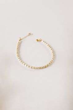 A bracelet version of the beloved Petite Pearl Choker. Tiny freshwater pearls and individually hammered gold fill spacer beads adorn this delicate bracelet! Layer it with these others, or wear it alone. 7" + 1" extender Handmade in Rockaway Beach Rockaway Beach, Hammered Gold, Pearl Choker, Spacer Beads, Pearl Bracelet, Delicate Bracelet, Freshwater Pearls, Gold Filled, Choker