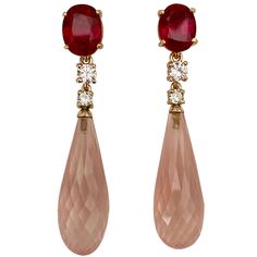 Rubies (origin: Karur, India) are showcased in these classically elegant dangle earrings. The rubies are a pure, vibrant red color and are well cut and polished. They are complimented by white diamonds. Finishing the composition are rose quartz briolette (origin: Brazil) in an elongated diamond pattern. The one-of-a-kind mountings are fabricated in 18k yellow gold and come with posts and jumbo friction backs. 1stdibs Jewelry, West Indian Bangles, Morganite Jewelry, Indian Bangles, Accessory Jewelry, Rose Quartz Earrings, Diamond Dangle Earrings, Baroque Pearl Necklace, Statement Jewellery